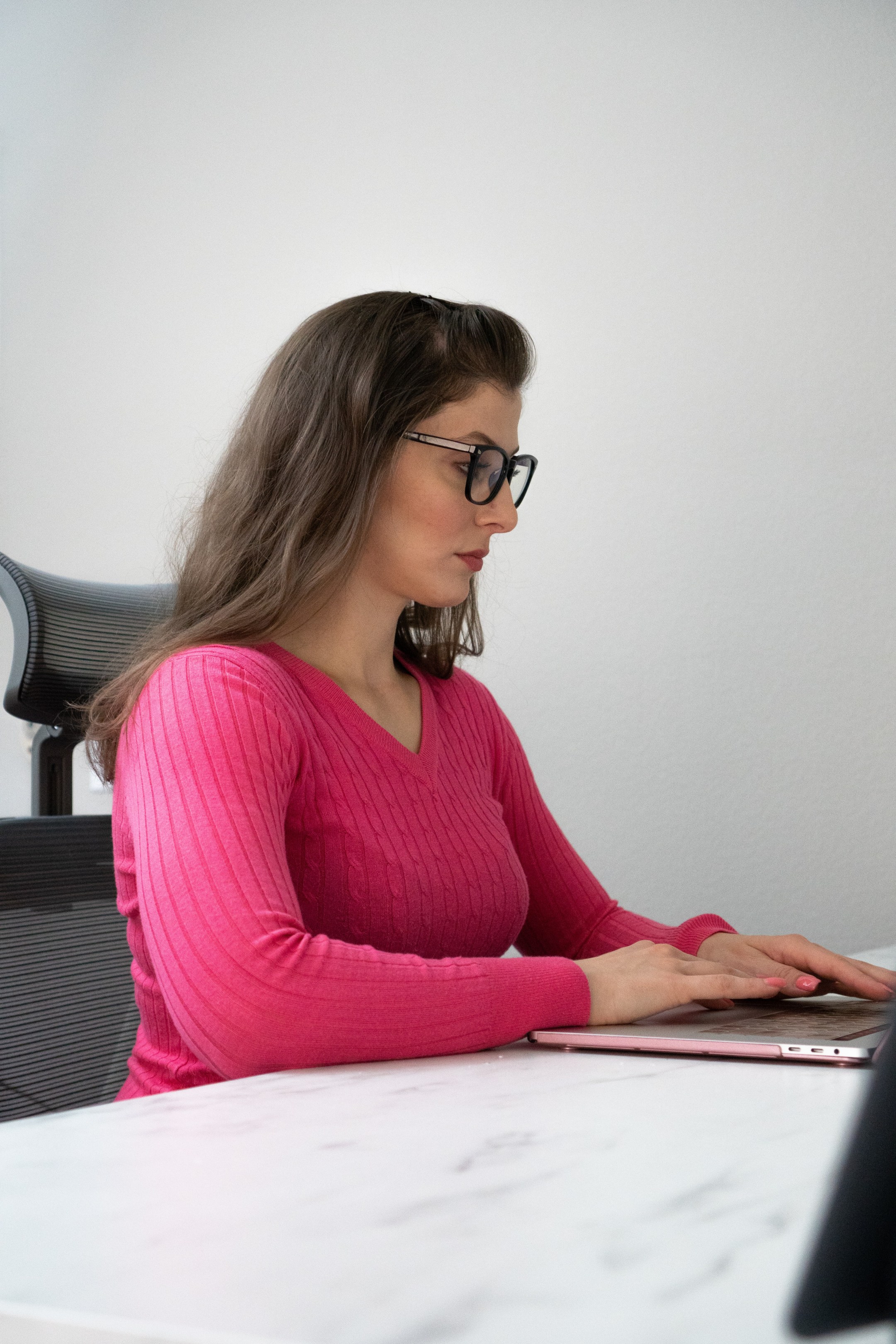 Megan Typing on Laptop